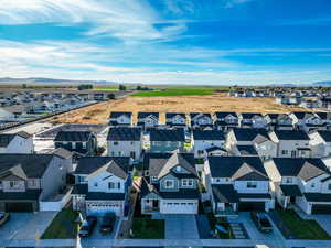Aerial view of residential area featuring a mountainous background