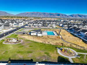 Aerial perspective of suburban area with a mountainous background