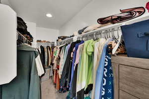 Primary room Walk in closet featuring carpet floors