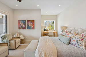 Carpeted bedroom featuring recessed lighting and a ceiling fan