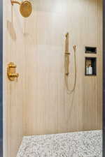 Full bath with a tile shower