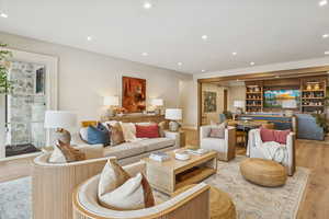 Living area featuring wood finished floors and recessed lighting