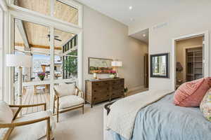 Carpeted bedroom featuring a spacious closet and recessed lighting