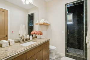 Full bath with vanity and a stall shower