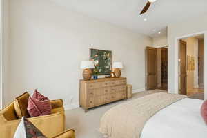 Bedroom with carpet floors, recessed lighting, ceiling fan, and ensuite bathroom