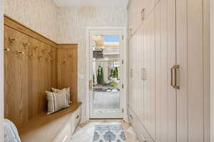 Mudroom featuring light tile patterned floors