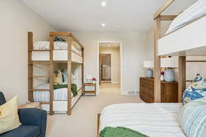 Bedroom featuring light colored carpet and recessed lighting
