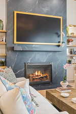 Detailed view of a premium fireplace and wood finished floors