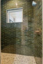 Bathroom with tiled shower