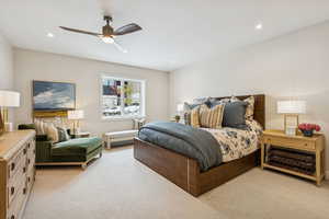 Bedroom featuring light colored carpet, ceiling fan, and recessed lighting