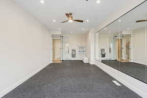 Unfurnished living room with recessed lighting and ceiling fan
