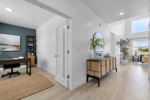 Office featuring recessed lighting, a textured ceiling, and light wood-style flooring