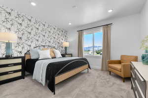 Bedroom featuring an accent wall, light carpet, wallpapered walls, a mountain view, and recessed lighting