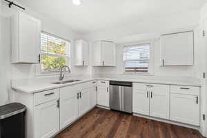 Kitchen featuring white cabinets, plenty of natural light, and recessed lighting