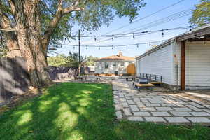 Fenced backyard with a patio