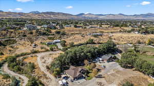 Aerial overview of property's location featuring a mountain backdrop and a desert landscape
