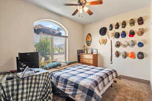 Bedroom with carpet flooring and a ceiling fan