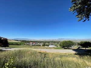View of mountain backdrop with rural landscape