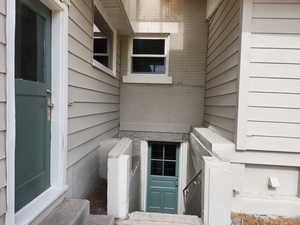 Entrance to property with brick siding