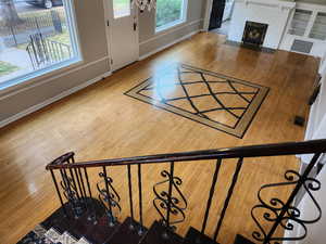 Interior space featuring wood-type flooring and a fireplace