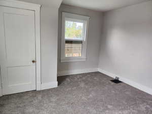 Unfurnished bedroom with carpet