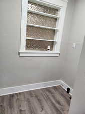 Detailed view of a textured wall and wood finished floors