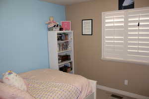 Bedroom featuring carpet floors and a textured ceiling