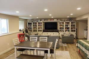 Dining room with recessed lighting and light wood finished floors