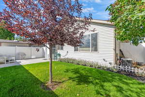 Fenced backyard featuring a patio