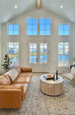 Living area with recessed lighting, french doors, light wood-style flooring, high vaulted ceiling, and beamed ceiling