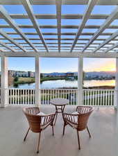 View of patio with a water view