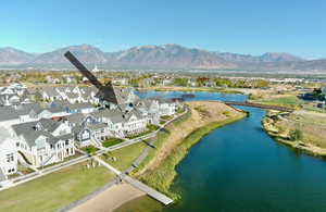 View of property location with nearby suburban area and a water and mountain view