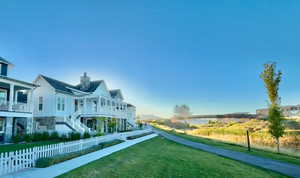 Surrounding community featuring stairway, covered porch, and a residential view