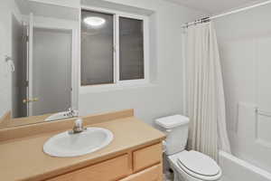 Bathroom with vanity and shower / bath combo