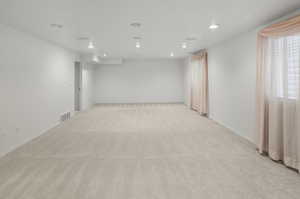 Spare room featuring carpet flooring and recessed lighting