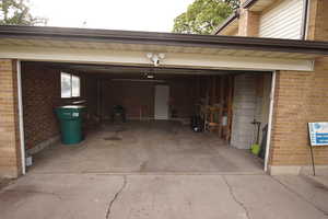Garage featuring driveway