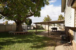 Fenced backyard with a patio area