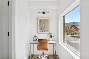 Office featuring wood finished floors and a mountain view