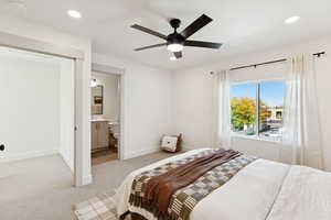 Bedroom with carpet floors, recessed lighting, connected bathroom, and ceiling fan