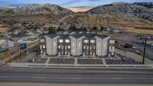Aerial view of property's location with a mountain backdrop