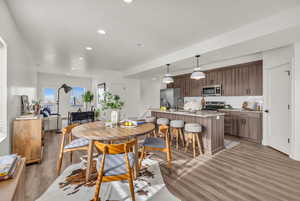 Dining room featuring light wood-style flooring and recessed lighting