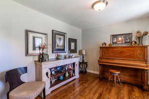 Sitting room featuring dark wood finished floors and a textured ceiling