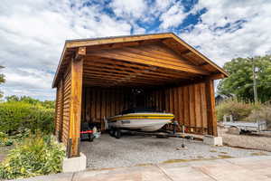 Garage featuring a carport