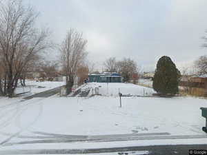 View of yard covered in snow