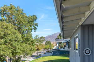 View of grassy yard featuring a mountain view