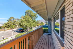 Deck along front of house