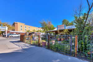 View of home's community with a gate