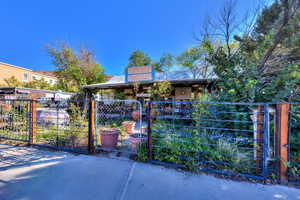 Gate featuring a fenced front yard