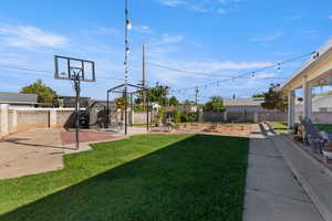 Fenced backyard featuring a patio