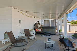 View of patio featuring a hot tub